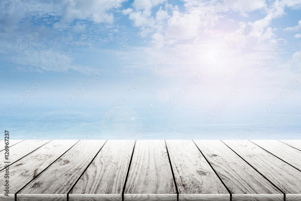 Empty old wooden table with ocean and blue skies background blurred. Concept Summer, Beach, Sea, Ocean, Relax.