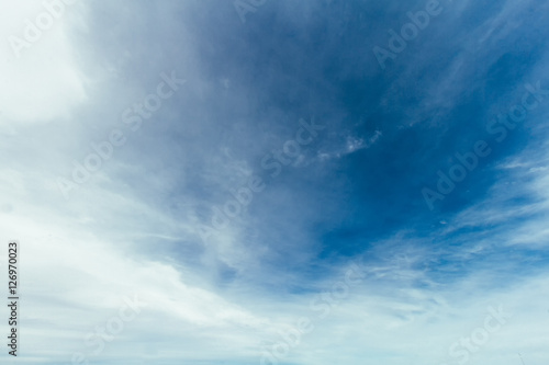 Blue sky with soft clouds and sunlight