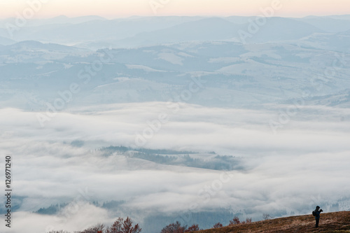 Siilhouette of man at amazing picturesque landscape of Carpathia photo