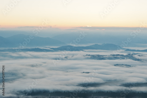 Amazing picturesque landscape of Carpathian mountains on fog and © AS Photo Family