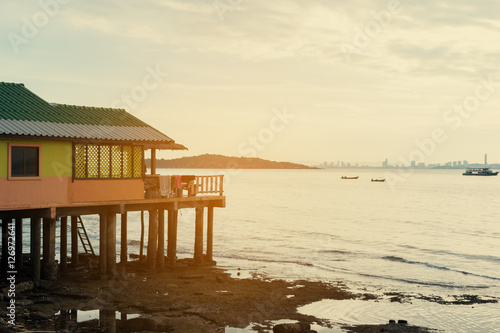 close up view of house at shore with copy space for text . concept of feeling peaceful relax and enjoy life. vintage tone sunshine effect. travel location at Thailand.