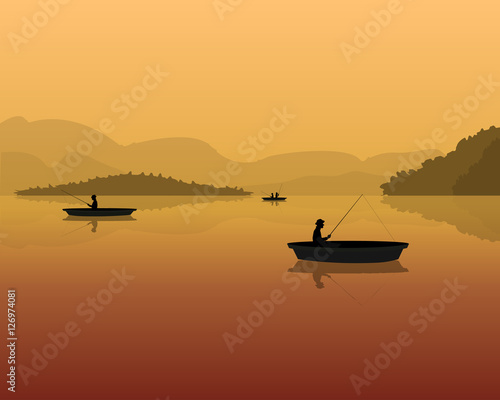 silhouette of fishermen in a boat with fishing rods in the water. landscape with mountains, forest and sunset.