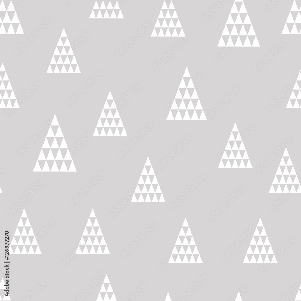 Seamless pattern of white geometric christmas trees. Wrapping paper. Hand drawn vector illustration.