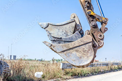 Excavator is carrying two buckets inserted into one another, sor