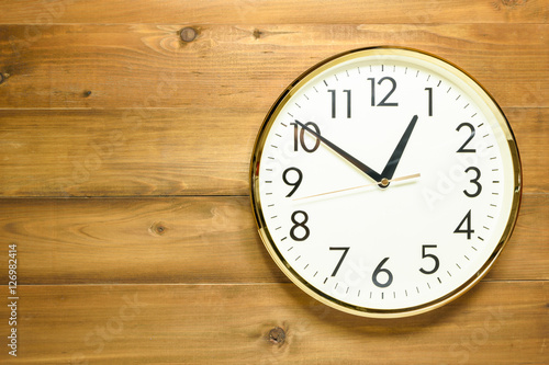 wall clock on the wooden wall