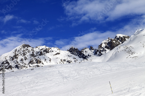 Ski slope at sun winter day
