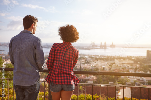 Photos Young couple chatting on a bridge