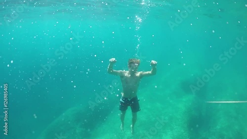 Wallpaper Mural SLOW MOTION, UNDERWATER: Exhausted and unexperienced swimmer drowning in ocean Torontodigital.ca