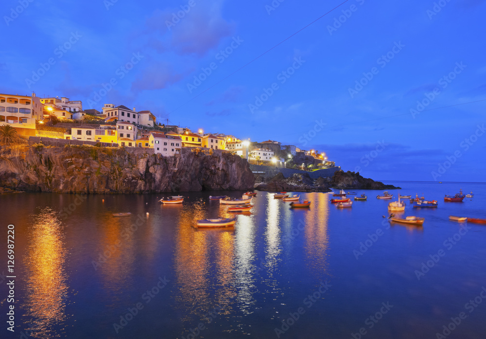 Portugal, Madeira, Twilight view of the fishermen port in the Camara de Lobos.