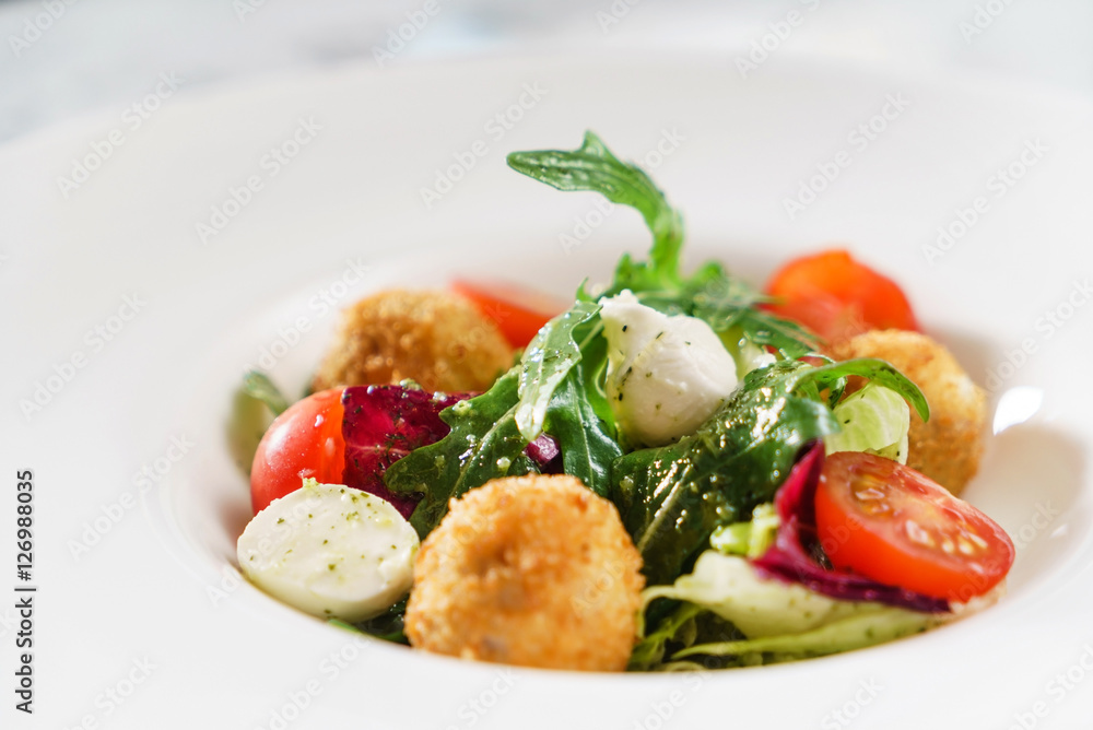 salad with fried mozzarella balls
