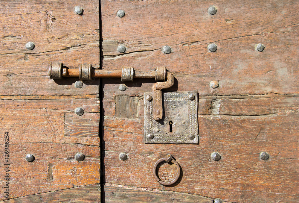 Details of an ancient Italian door in Florence, Italy. Details of an ancient Italian door in Florence, Italy.