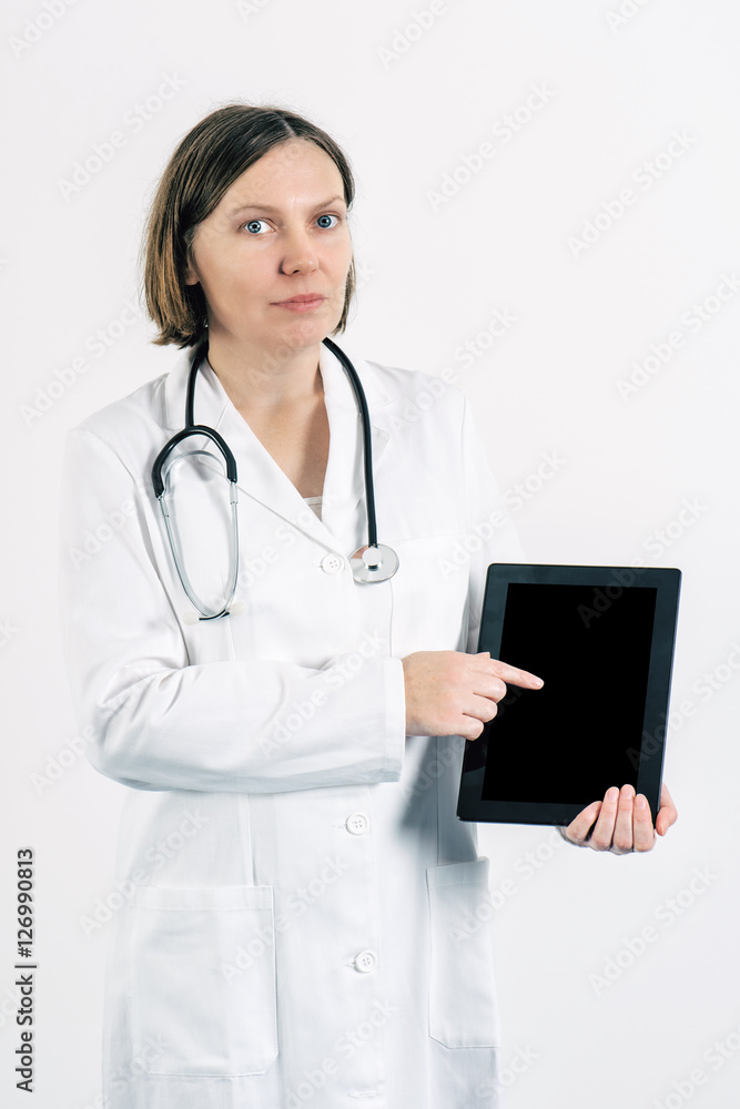 Female doctor finger pointing to blank tablet computer screen di Female doctor finger pointing to blank tablet computer screen di