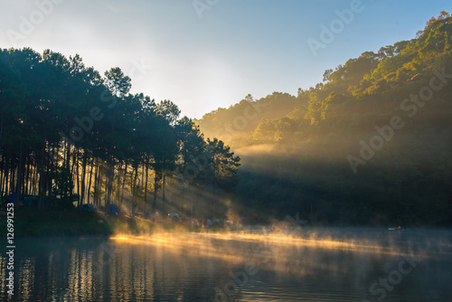 Morning in Pang Ung Lake,North of Thailand, is a tourist place where people come to vacation in the winter. Because of the large reservoir The cold causes steam to rise above the surface.