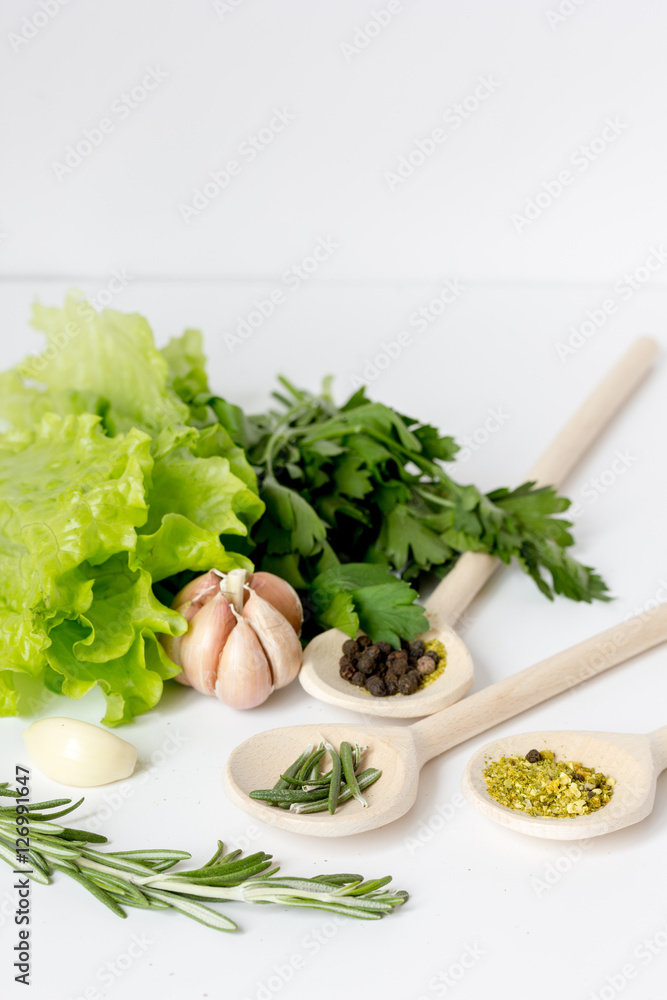 fresh salad with garlic and spices on white background fresh salad with garlic and spices on white background