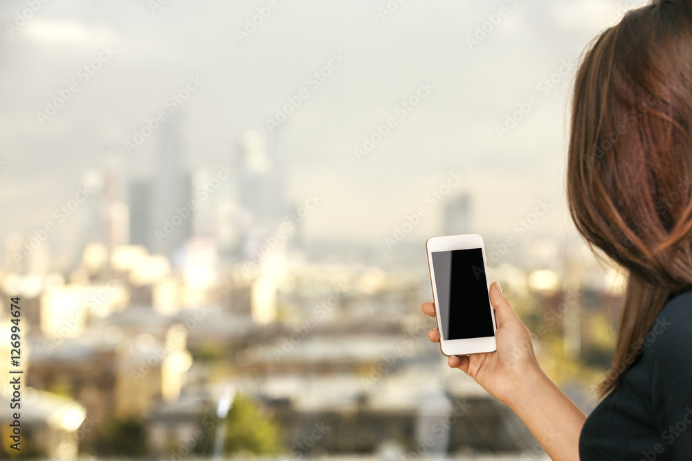 Girl holding mobile phone