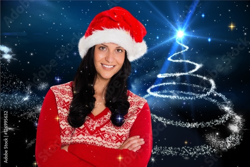 Beautiful woman in santa costume with arms crossed