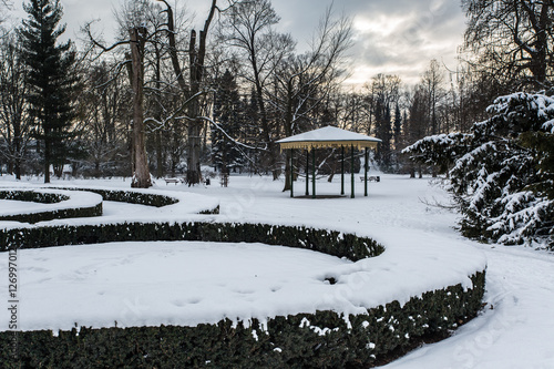 Pavilion covered in snow in castle garden in winter