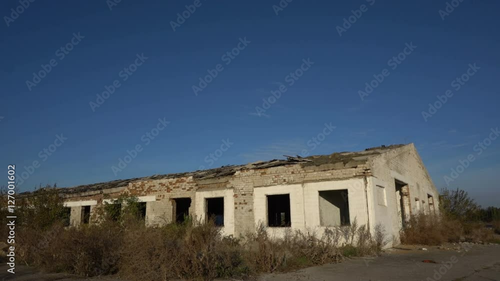 Old ruined farm animals. View from the outside. Dolly shot Old ruined farm animals. View from the outside. Dolly shot