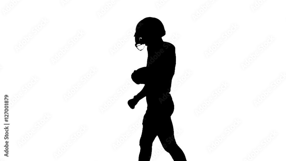 Football player carries the ball in his hand. Slow motion. Football player carries the ball in his hand. Slow motion.