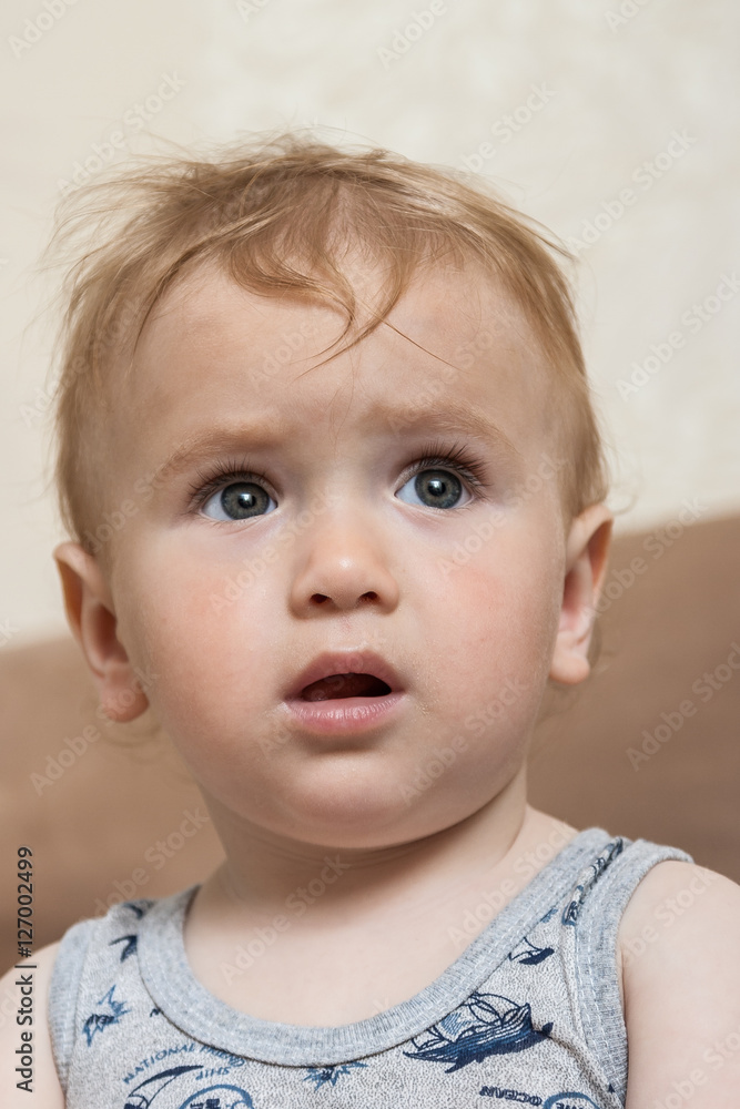 Portrait of a cute, charming kid looking forward Portrait of a cute, charming kid looking forward