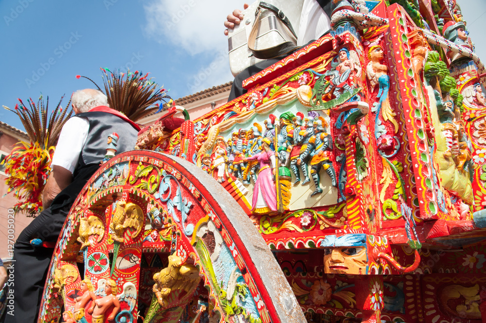 Fototapeta premium Partial view of a typical colorful Sicilian cart during a folk festival
