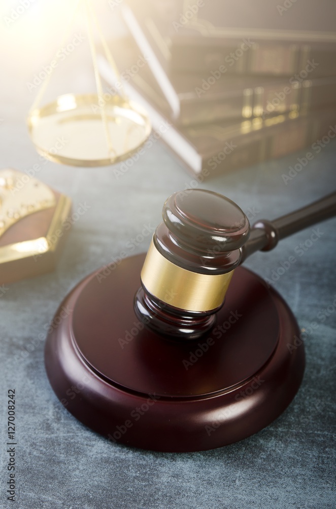 Gavel with books on grunge background Gavel with books on grunge background