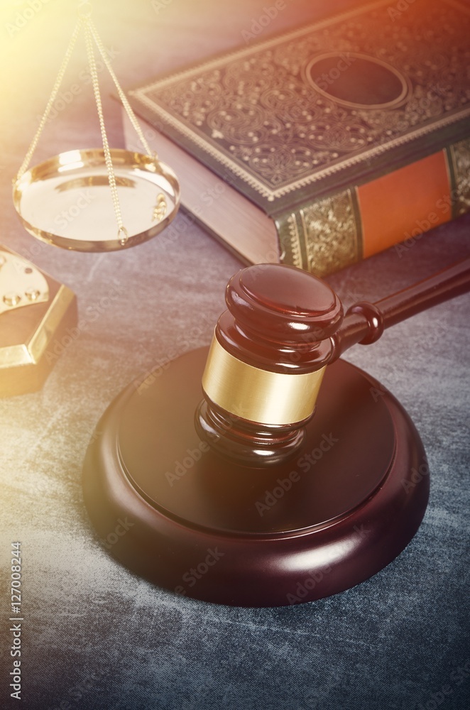 Gavel with books on grunge background Gavel with books on grunge background