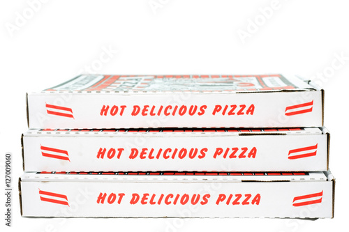 Stack of closed pizza boxes. Vertical.