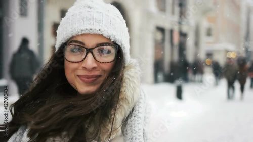 happiness, winter holidays, christmas, beverages and people concept - Attractive beautiful lady posing and flirting on camera over snowy city background