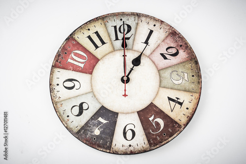 One o'Clock. Face of an antique/vintage clock indicating noon. Old-fashioned ticker isolated on white background. Watch shows lunchtime. 