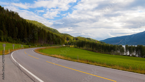 Norwegian highway car road in beautiful mountains, amazing summer landscape background, north Europe. Journey trip from Bergen to Oslo, asphalt road in beautiful nature of Norway, Scandinavia, Europe