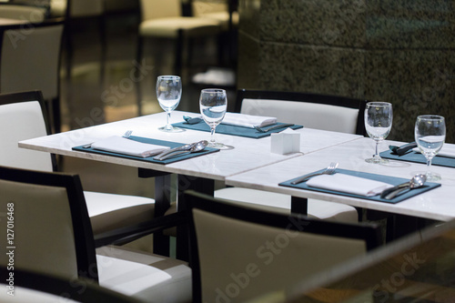 Glass of water placed on the dinner table.