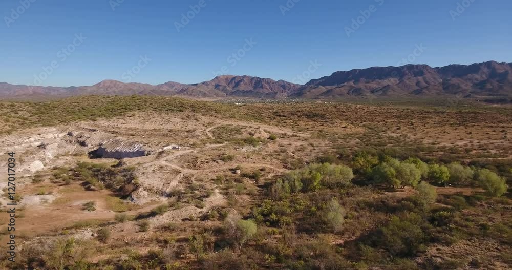A high angle aerial daytime flyover establishing shot of the Arizona desert. A high angle aerial daytime flyover establishing shot of the Arizona desert.