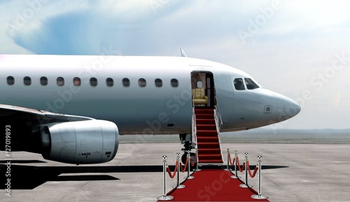 Fotografie Airplane departure entrance with red carpet