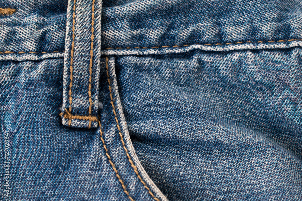 Blue denim jeans and pocket with macro style. Vintage fashion. Blue denim jeans and pocket with macro style. Vintage fashion.