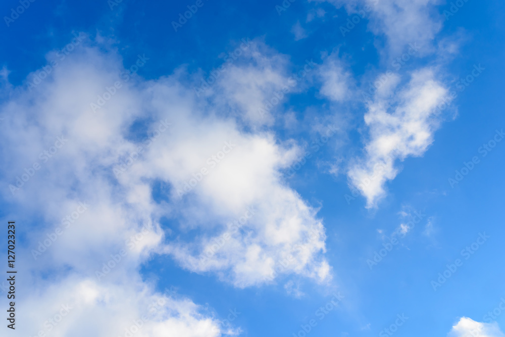 Bright blue sky & puffy clouds as background Bright blue sky & puffy clouds as background