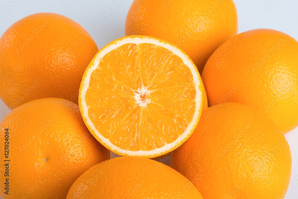 Fresh orange and cut in half on white background Fresh orange and cut in half on white background