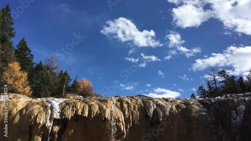 Huanglong Mountain with beautiful nature lime stone pond  ,waterfalls,lake  in Sichuan , China on sunny day
