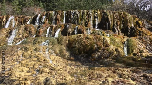 Huanglong Mountain with beautiful nature lime stone pond  ,waterfalls,lake  in Sichuan , China on sunny day