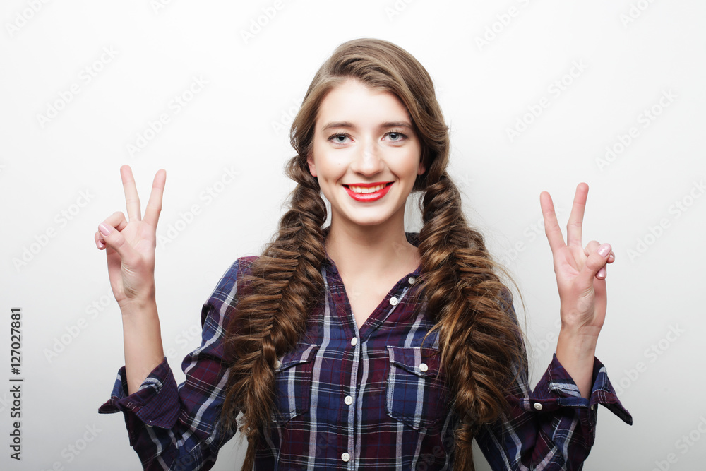 woman showing victory or peace sign woman showing victory or peace sign
