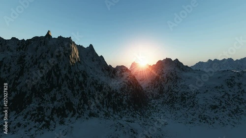 snowy mountain peak at sunrise