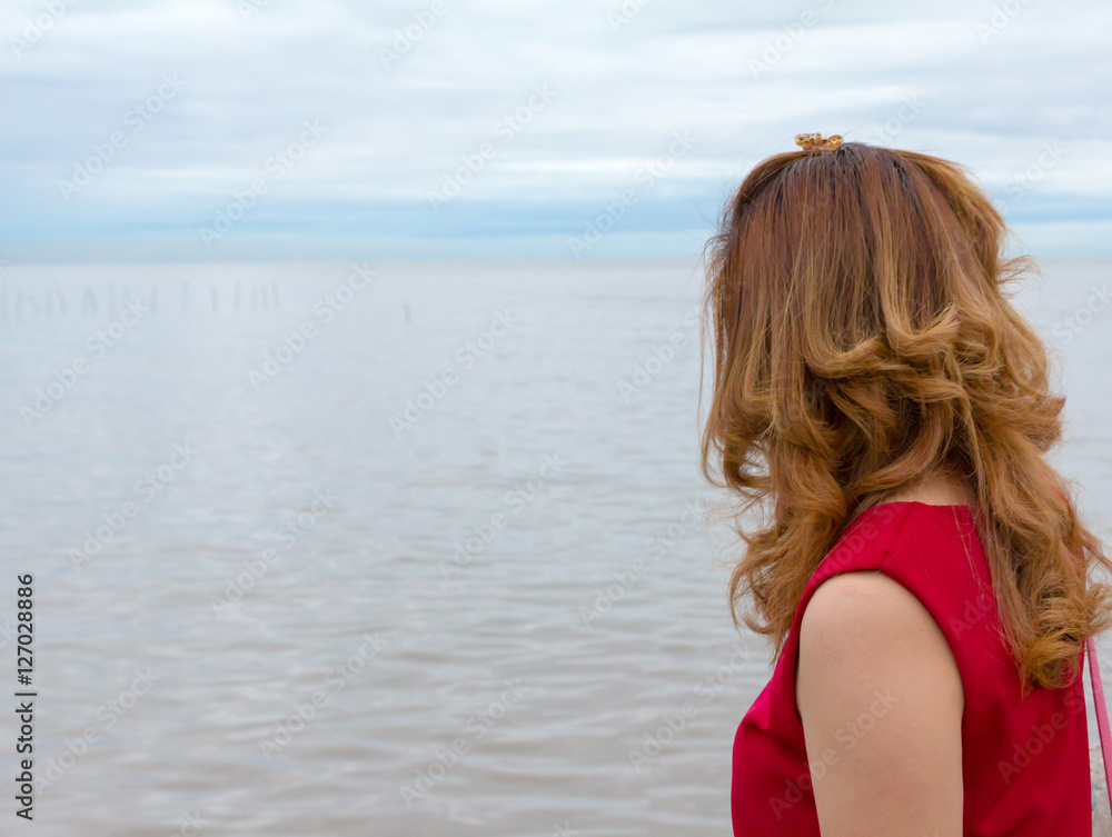 woman red shirt look at sea view feeling sad woman red shirt look at sea view feeling sad