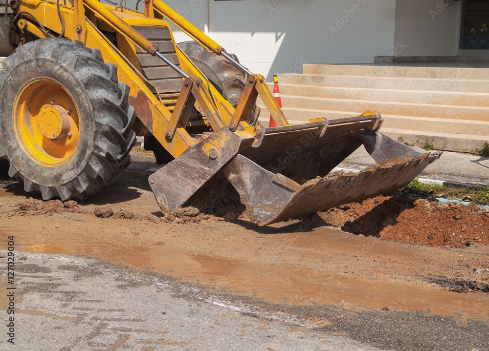 Fototapeta premium Excavator working on the Repair of pipe water 