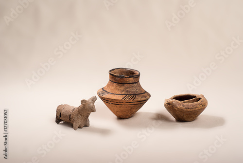 Ancient pottery Cucuteni culture (Trypillya) on a light background in studio photo