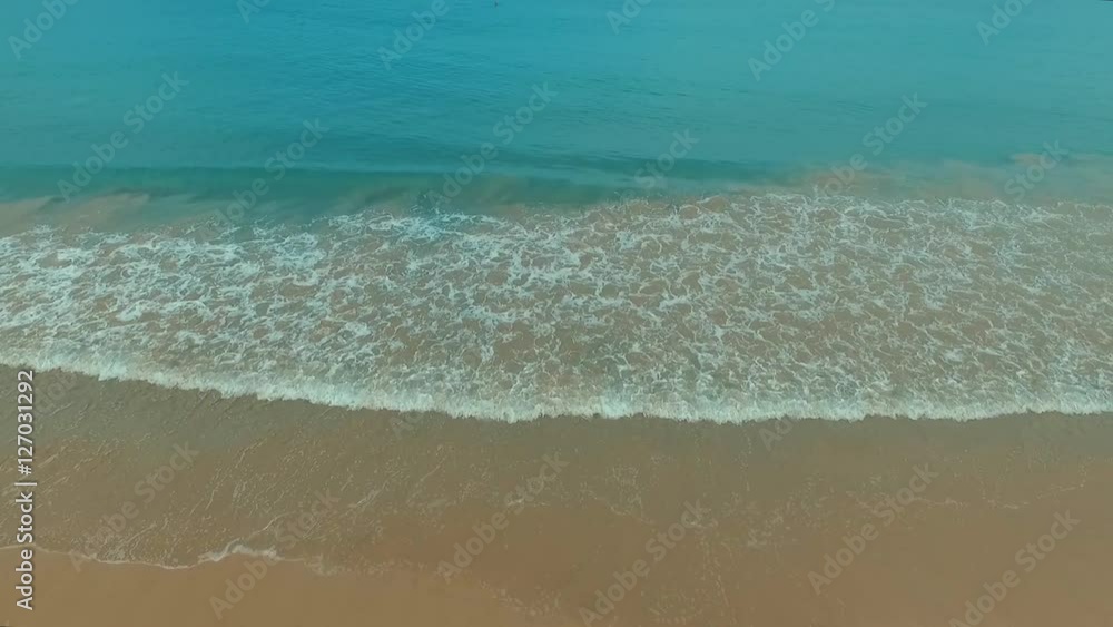 Aerial: Beautiful waves on the beach. Aerial: Beautiful waves on the beach.