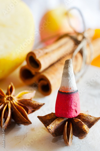 traditional Czech Christmas - smoking incense cones, star anise and cinnamon photo