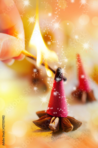 traditional Czech Christmas - smoking incense cones, star anise and cinnamon photo