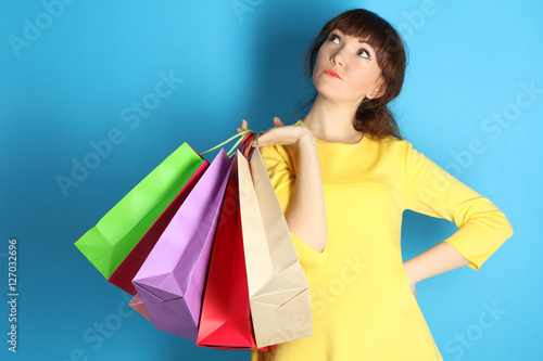 Super sale, shopping, discount, fashion concept: woman with many shopping bags 