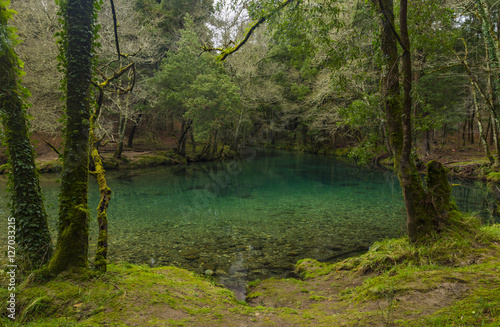lake in the mountain with green transparent water © César Torres