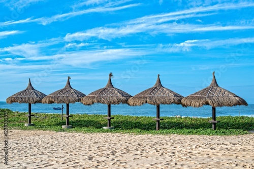 Palm umbrellas on a beach